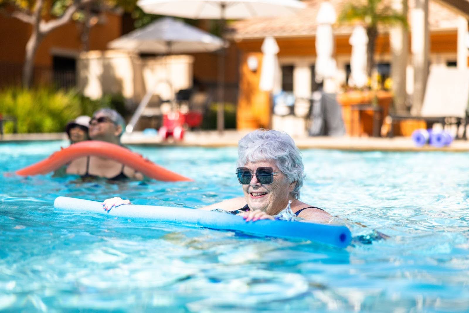 Senior woman doing pool aerobics 