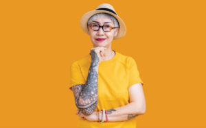 senior woman with a sleeve tattoo