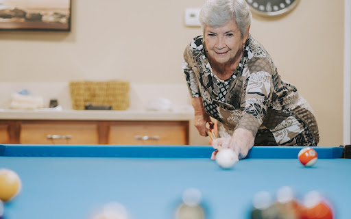 senior woman in the billiards club at freedom village