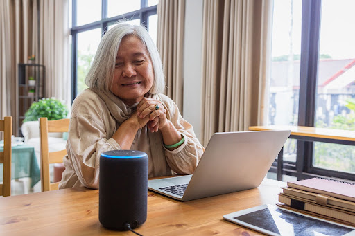 senior women setting up Amazon Alexa at home