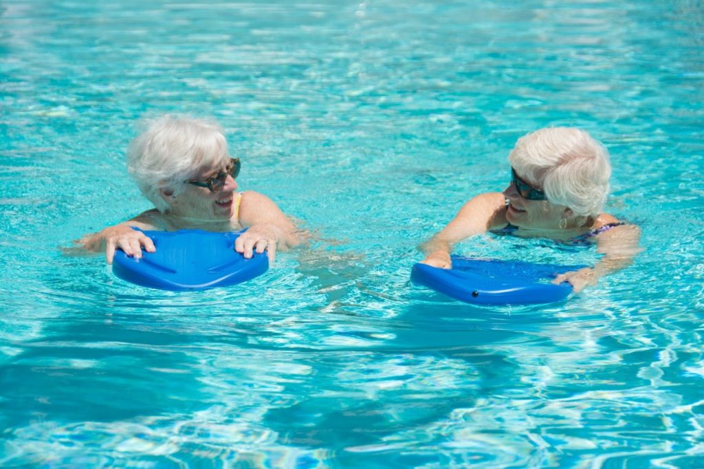Senior women exercising in a pool