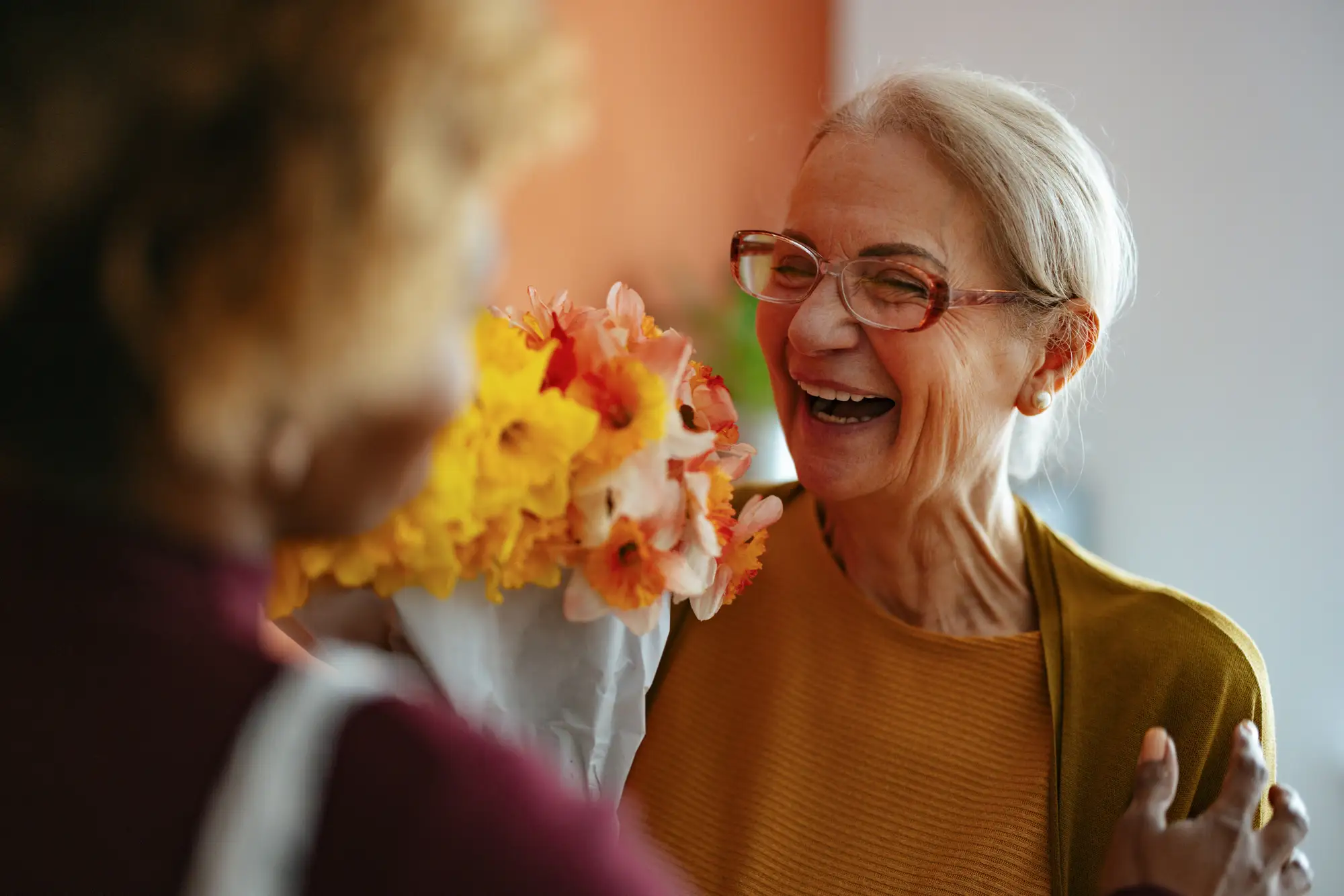 Senior woman receiving flowers