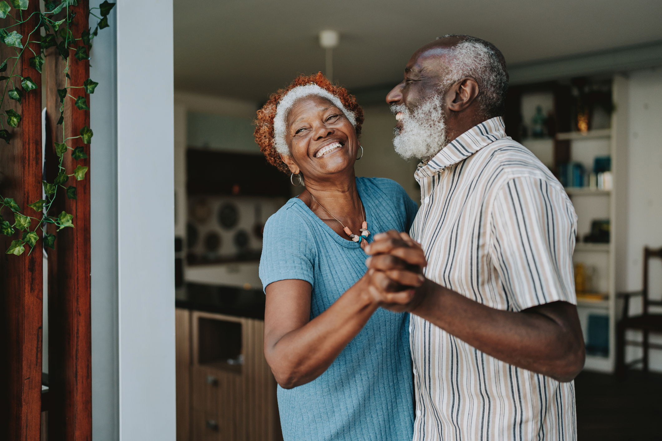 senior couple dancing in doorway