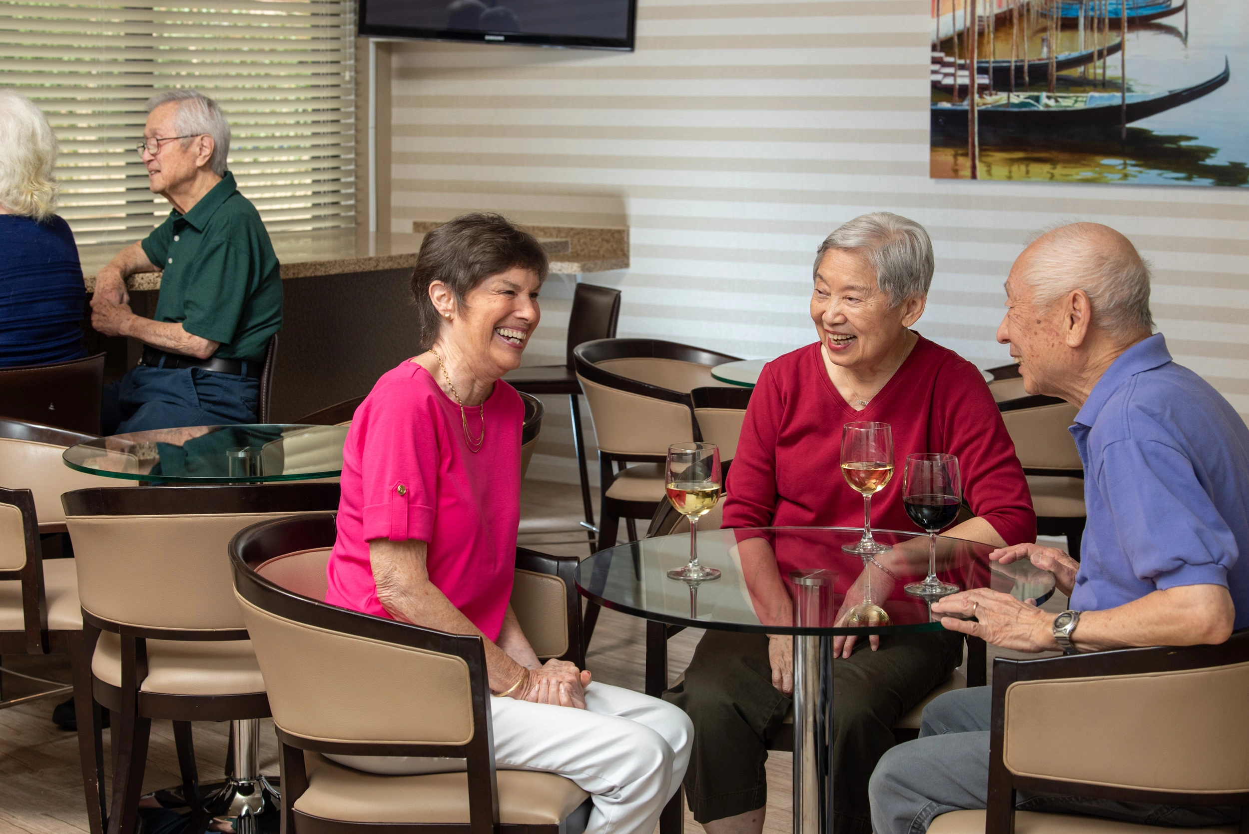Residents at Freedom Village enjoying drinks at Saddleback Lounge