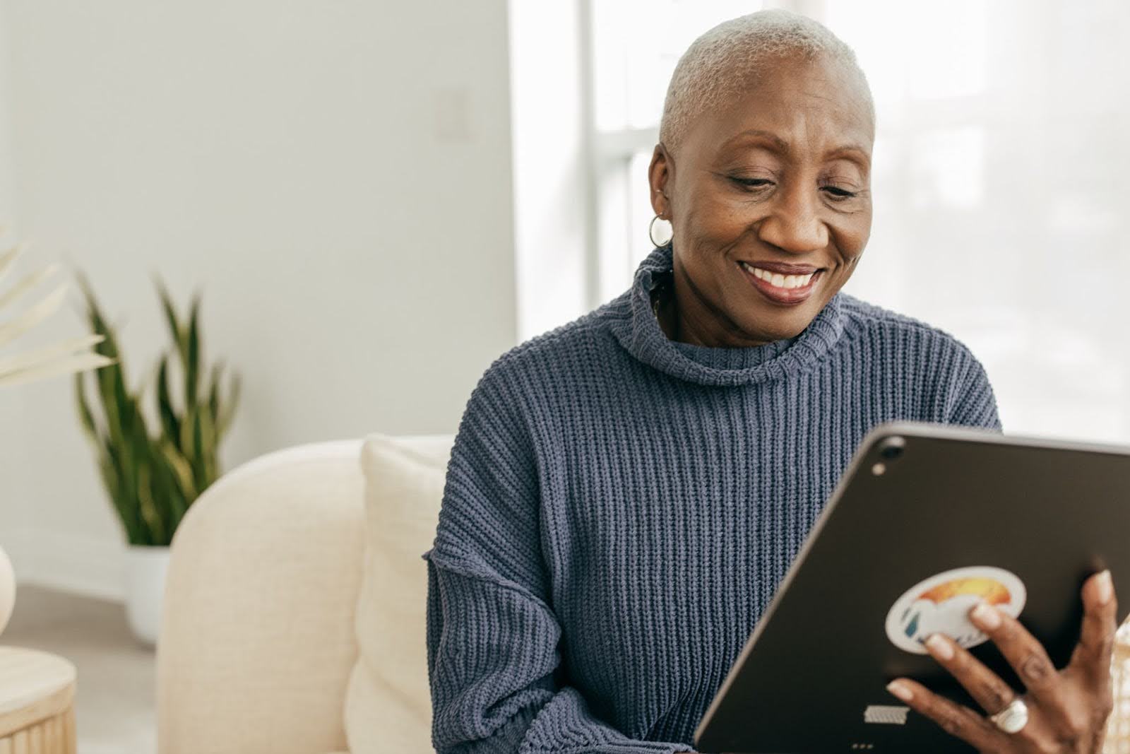 Senior lady looking at a tablet